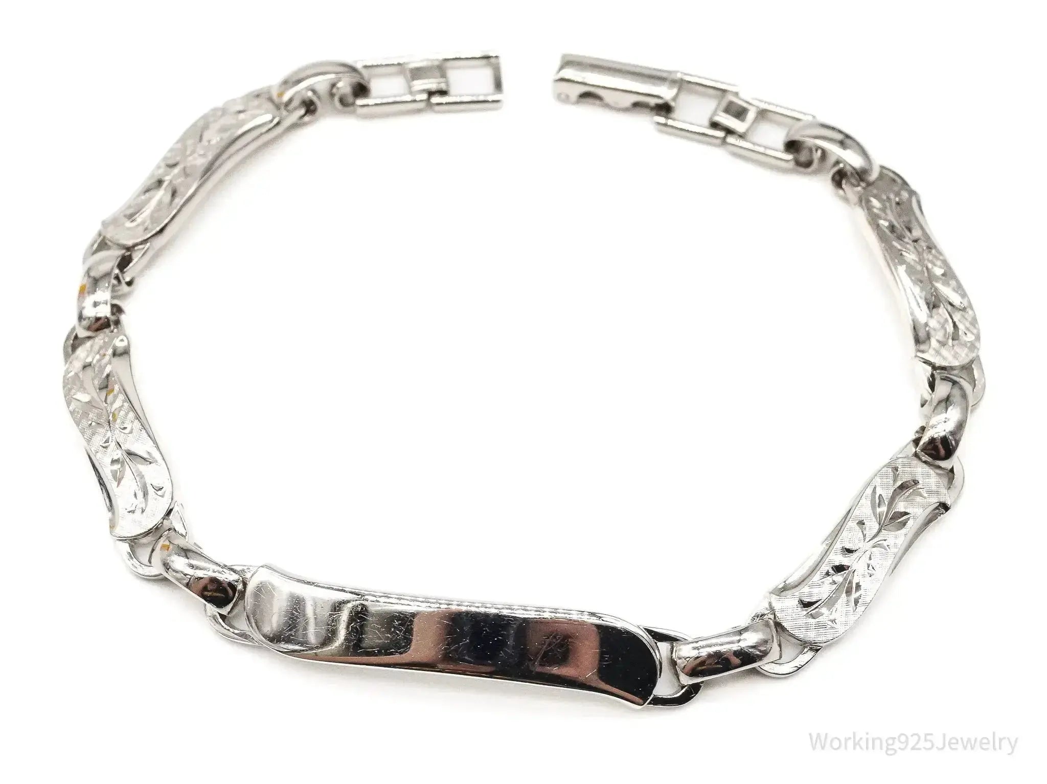 Vintage LaMode sterling silver ID bracelet by Plush Fashion Hub featuring a sleek bar design and personalized name engraving.