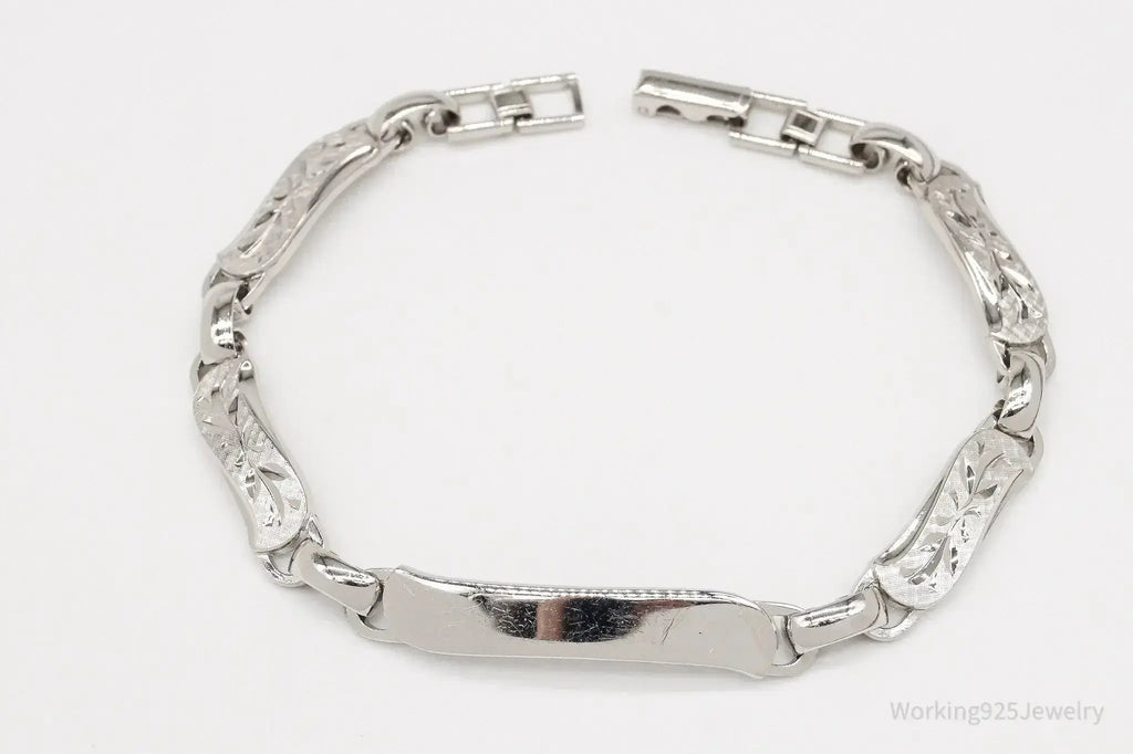 Vintage LaMode sterling silver ID bar bracelet featuring engraved name plate, stylish jewelry accessory from Plush Fashion Hub.