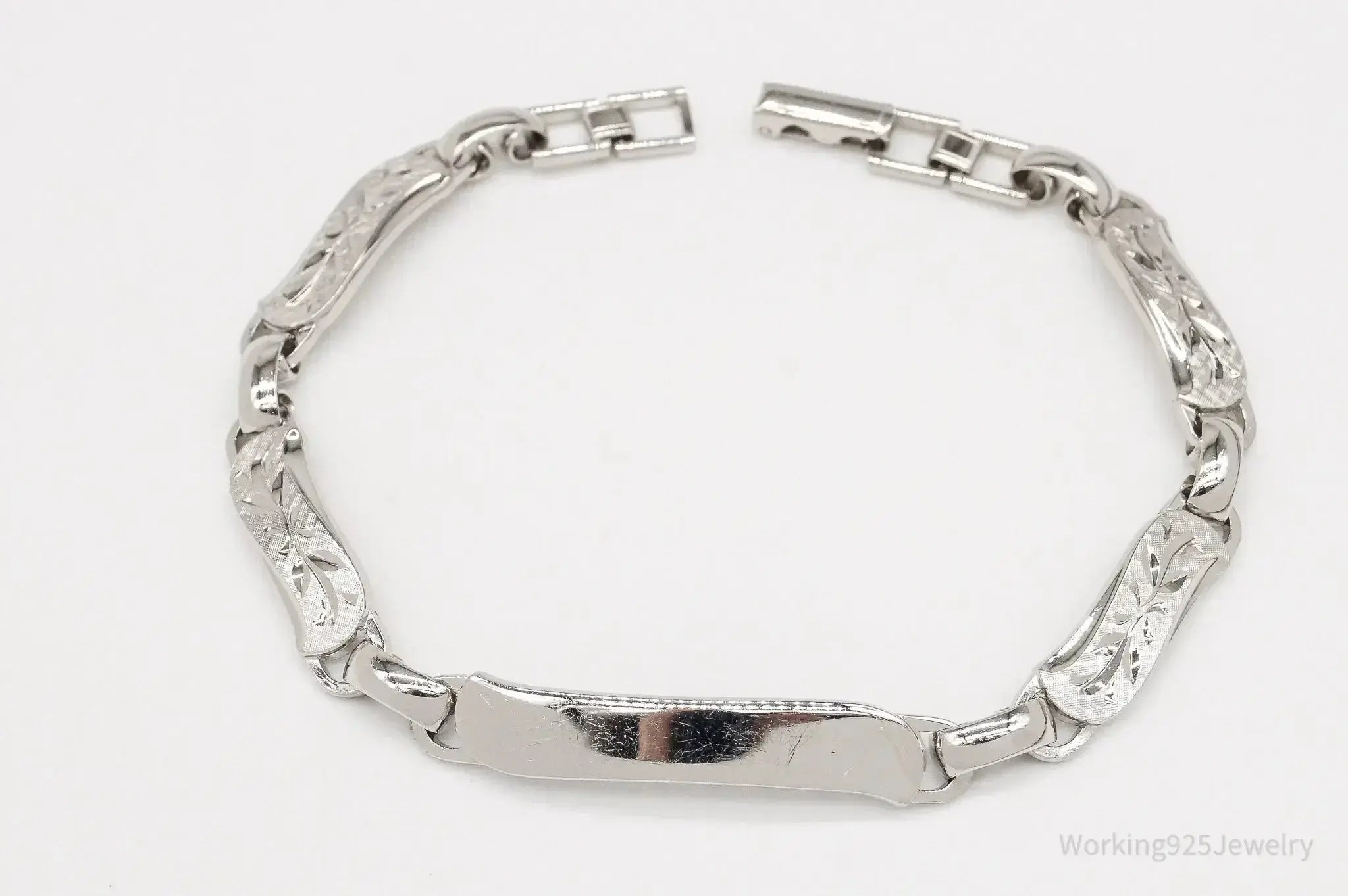 Vintage LaMode sterling silver ID bar bracelet featuring engraved name plate, stylish jewelry accessory from Plush Fashion Hub.