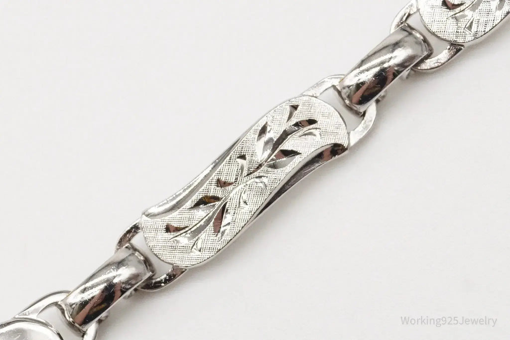 Vintage LaMode sterling silver ID bracelet with engraved name bar, stylish jewelry piece from Plush Fashion Hub.