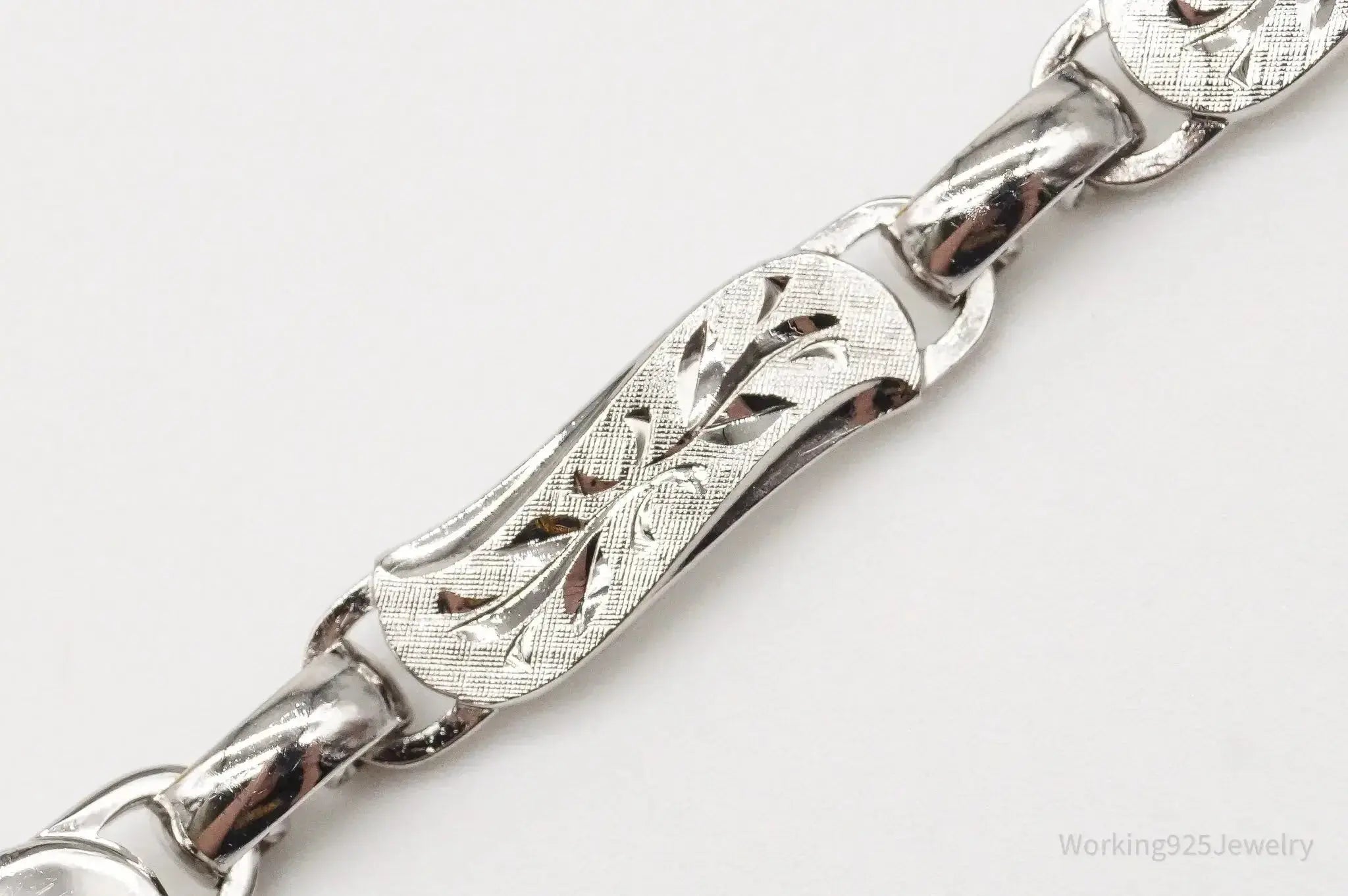 Vintage LaMode sterling silver ID bracelet with engraved name bar, stylish jewelry piece from Plush Fashion Hub.
