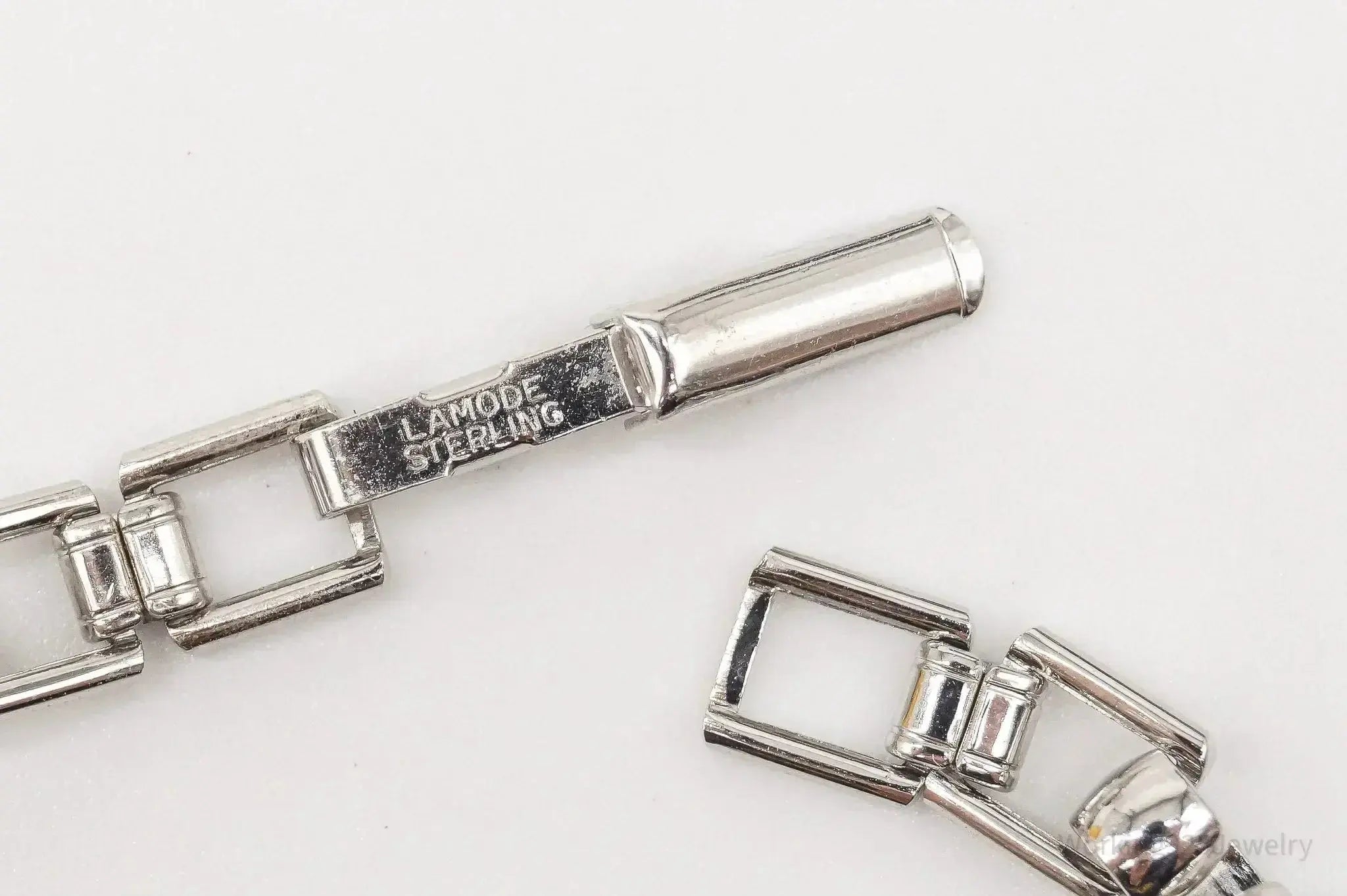 Vintage LaMode sterling silver ID bar bracelet featuring engraved name tag, stylish jewelry piece from Plush Fashion Hub.