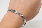 Vintage LaMode sterling silver ID bar bracelet with designer details, featuring a sleek and classic jewelry style.