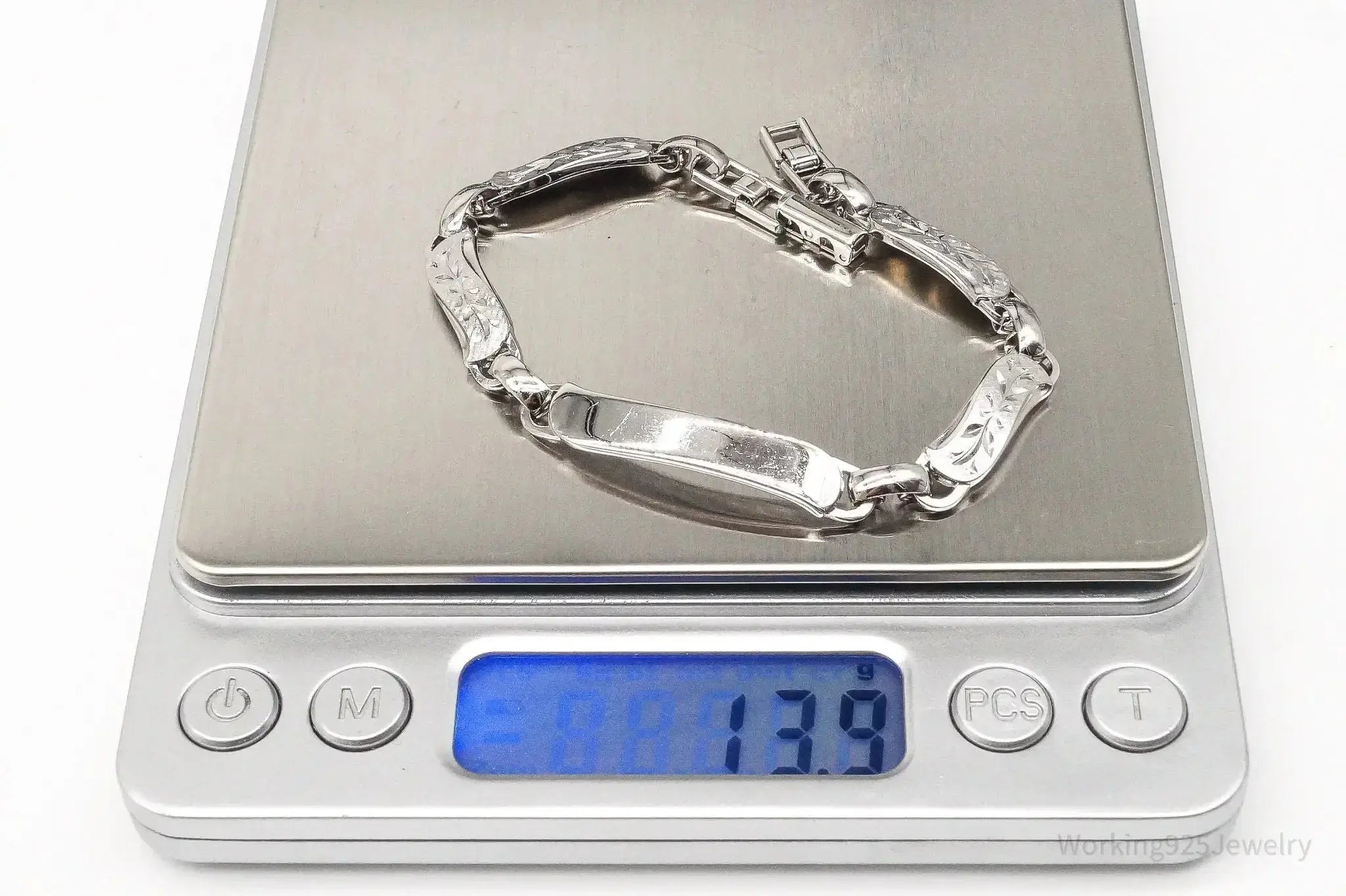 Vintage LaMode sterling silver ID bar bracelet with designer detailing, crafted by Plush Fashion Hub.