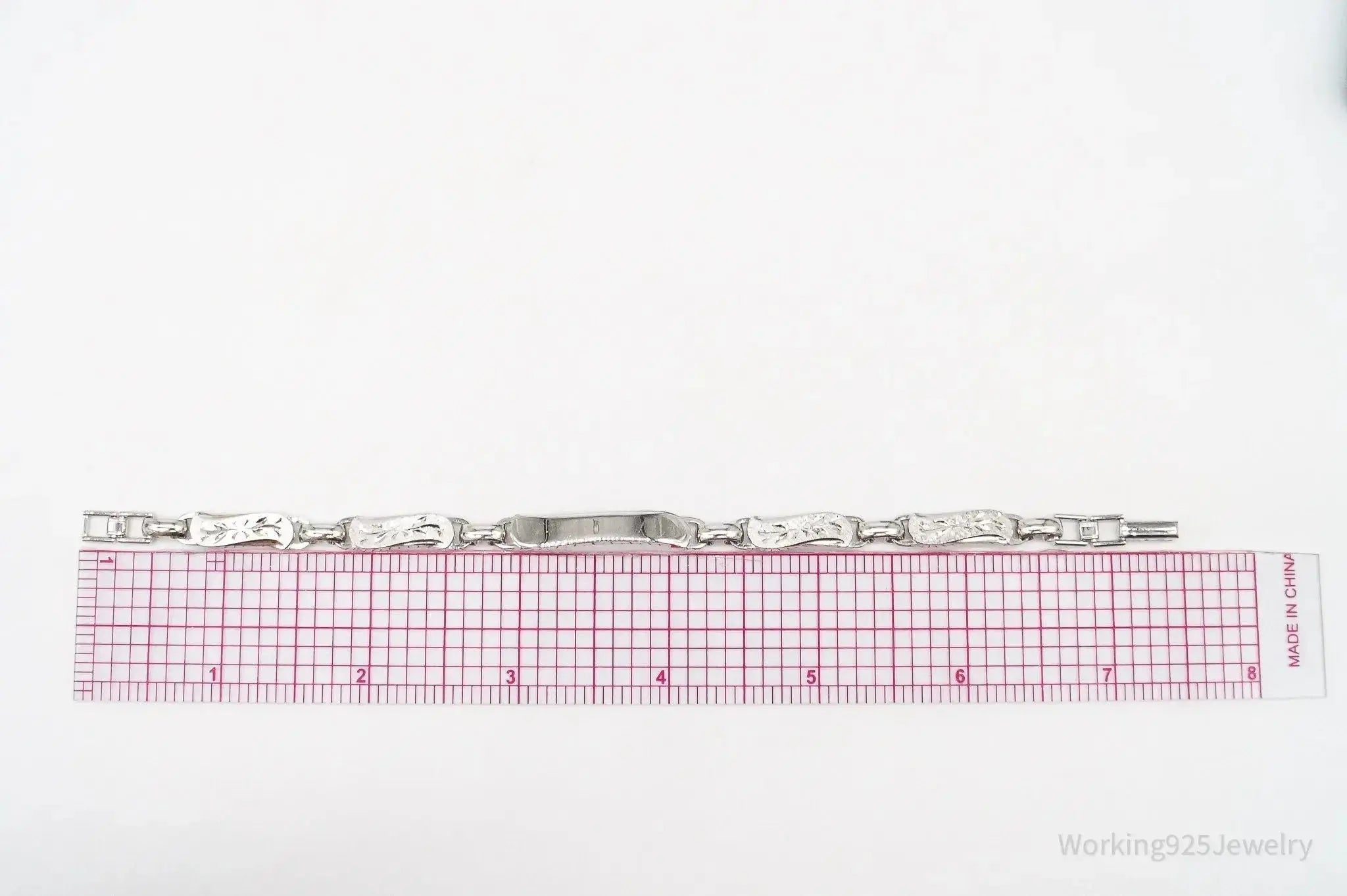 Vintage LaMode sterling silver ID bar bracelet with engraved name tag, stylish jewelry piece by Plush Fashion Hub.