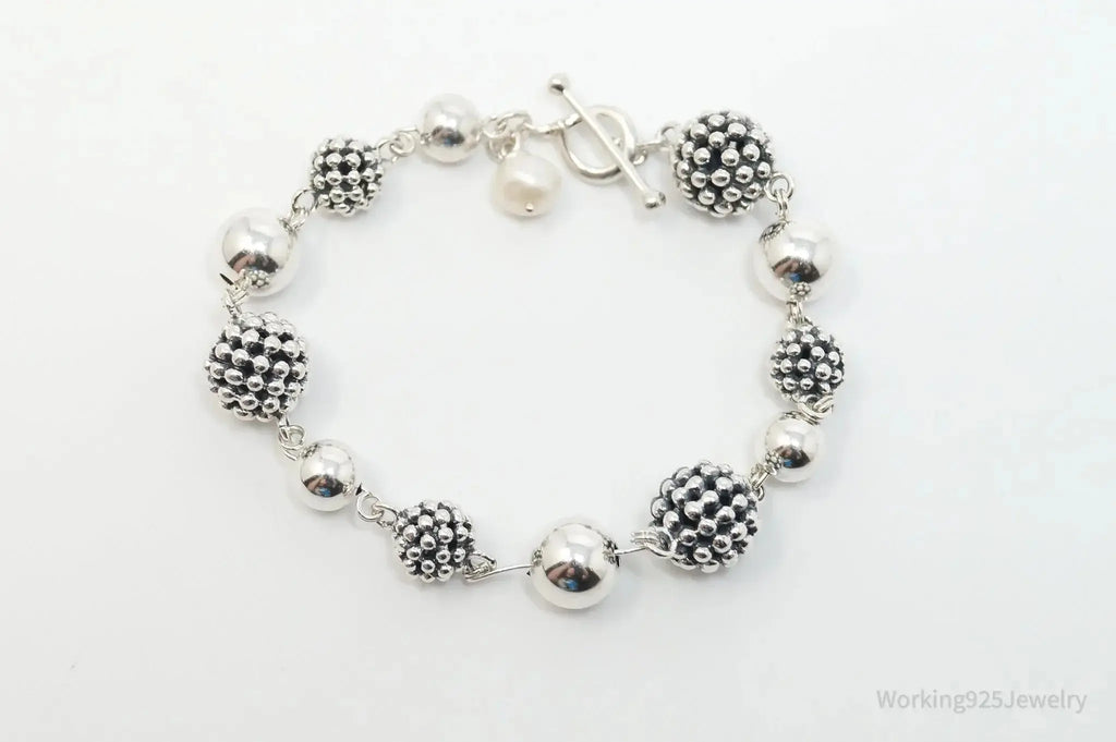 Vintage Michael Dawkins sterling silver bracelet with pearl-spotted ball design, elegant jewelry piece.
