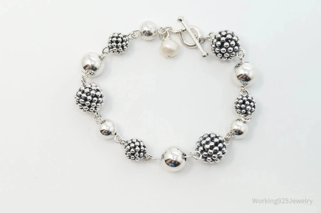 Vintage Michael Dawkins sterling silver bracelet with pearl-spotted ball design, elegant jewelry piece featuring intricate craftsmanship.