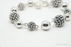 Vintage Michael Dawkins sterling silver bracelet with pearl-spotted ball design, elegant jewelry accessory.
