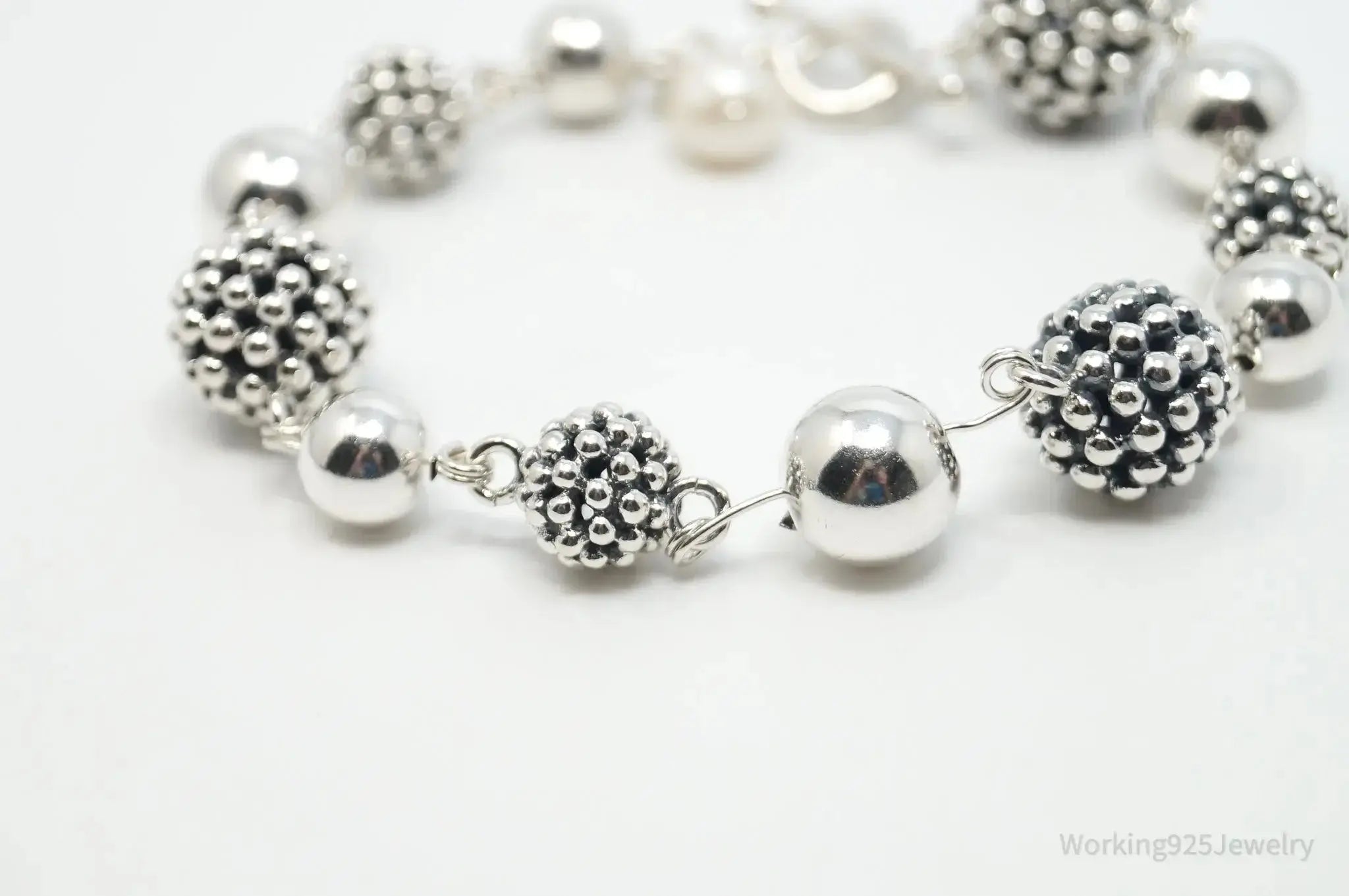 Vintage Michael Dawkins sterling silver bracelet with pearl-spotted ball design, elegant jewelry accessory.