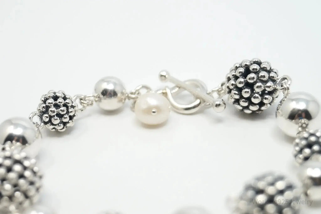 Vintage Michael Dawkins sterling silver bracelet with pearl-spotted ball design, jewelry accessory featuring elegant craftsmanship.