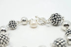 Vintage Michael Dawkins sterling silver bracelet with pearl-spotted ball design, jewelry accessory featuring elegant craftsmanship.