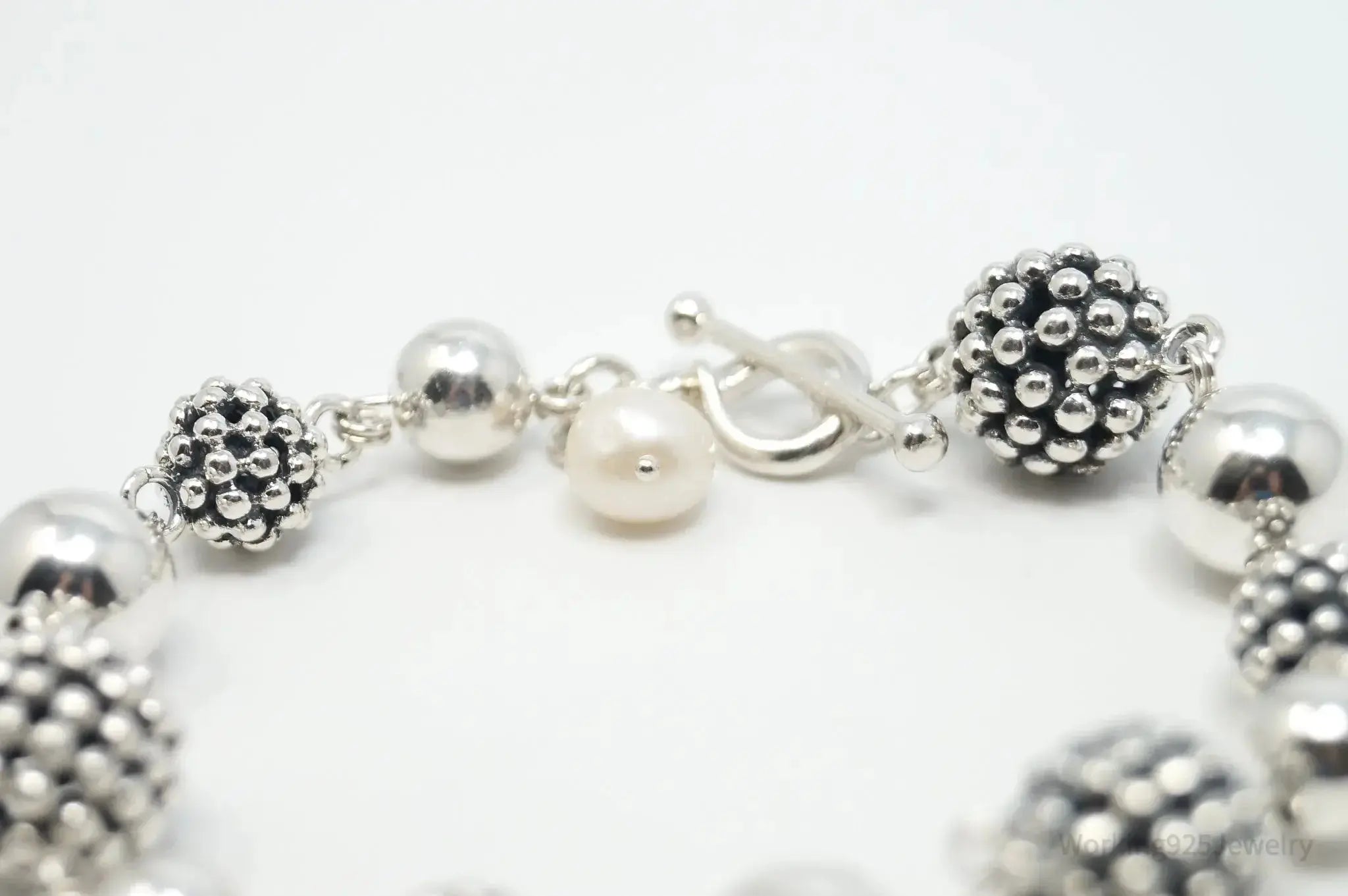 Vintage Michael Dawkins sterling silver bracelet with pearl-spotted ball design, jewelry accessory featuring elegant craftsmanship.
