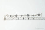 Vintage Michael Dawkins sterling silver bracelet with pearl-spotted ball design, crafted for elegant jewelry style.