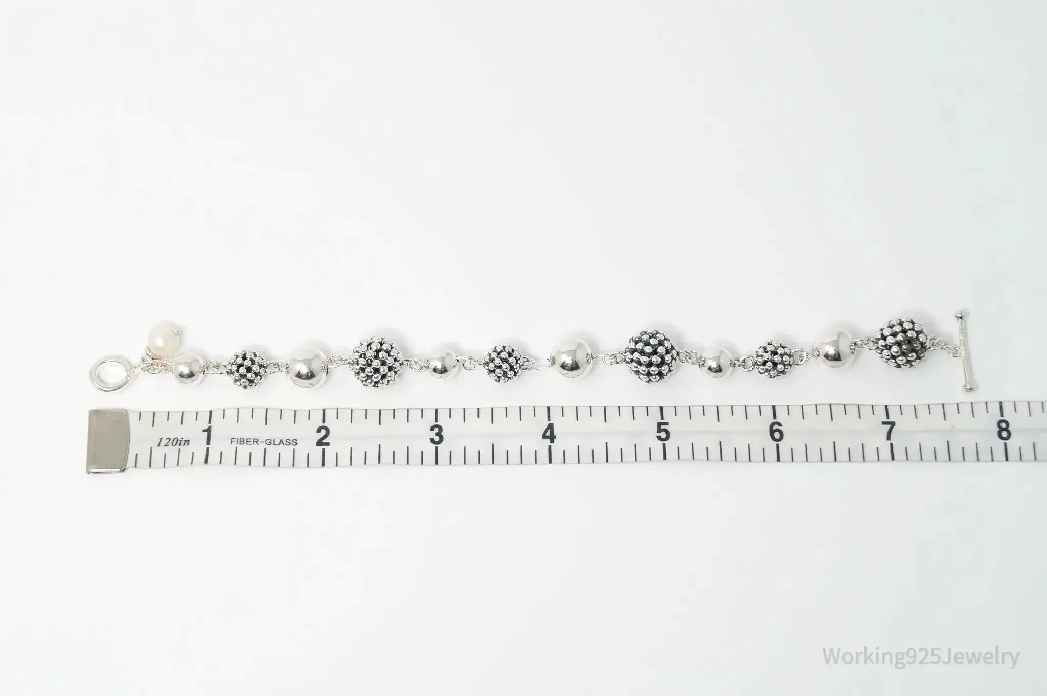Vintage Michael Dawkins sterling silver bracelet with pearl-spotted ball design, crafted for elegant jewelry style.