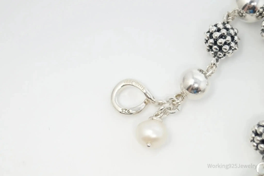Vintage Michael Dawkins sterling silver bracelet with pearl-spotted ball design, featuring elegant jewelry craftsmanship.
