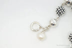 Vintage Michael Dawkins sterling silver bracelet with pearl-spotted ball design, featuring elegant jewelry craftsmanship.