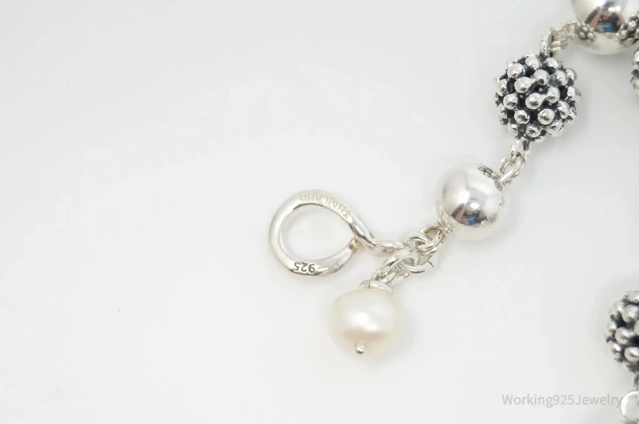 Vintage Michael Dawkins sterling silver bracelet with pearl-spotted ball design, featuring elegant jewelry craftsmanship.