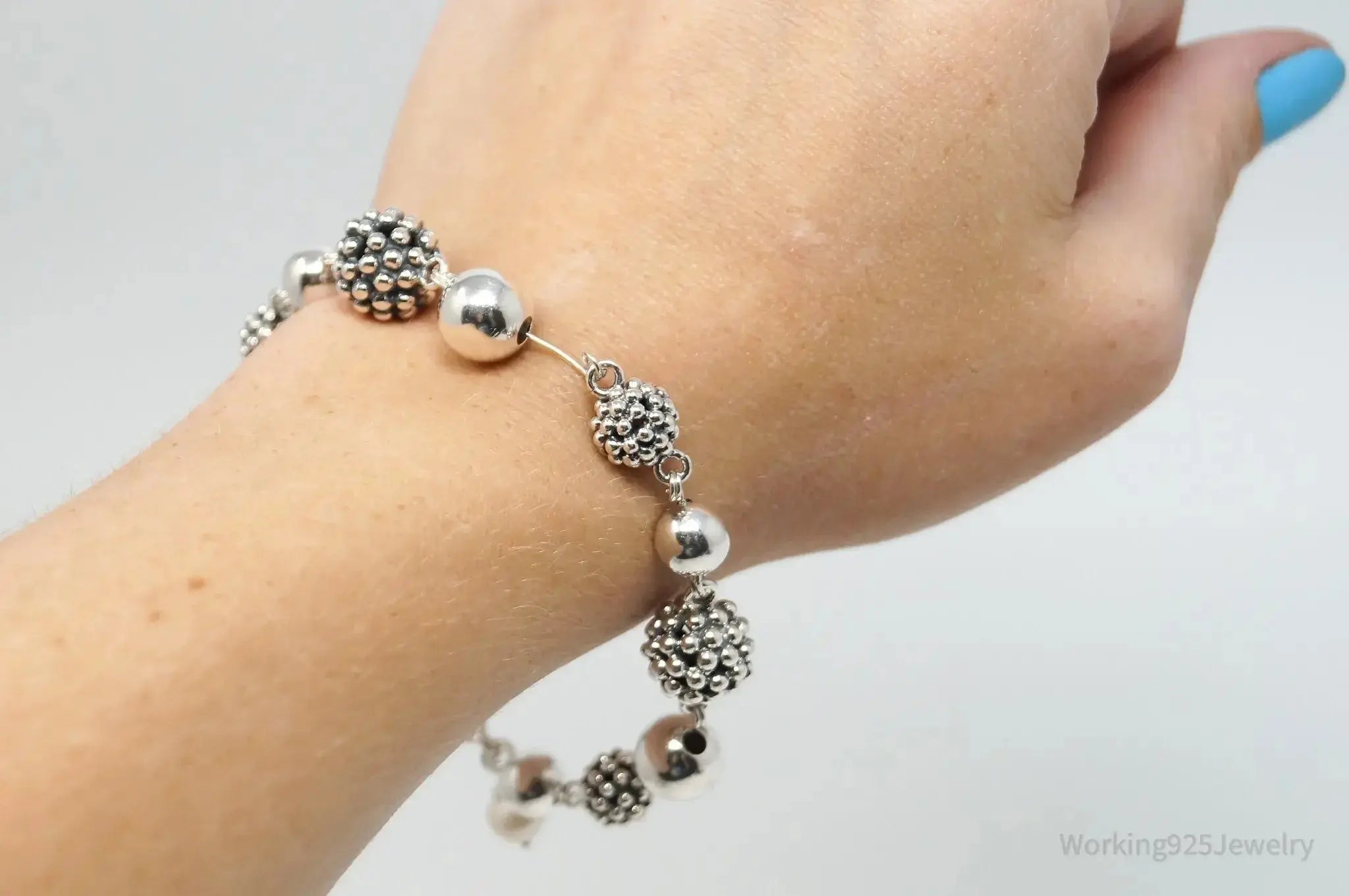 Vintage Michael Dawkins sterling silver bracelet with pearl-spotted ball design, featuring elegant jewelry craftsmanship.