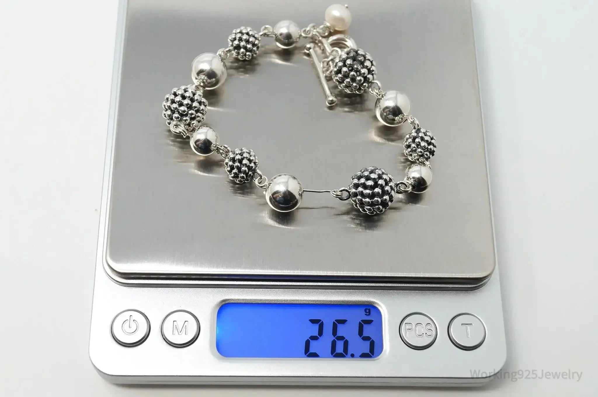 Vintage Michael Dawkins sterling silver bracelet with pearl-spotted ball design, jewelry accessory featuring intricate metalwork.