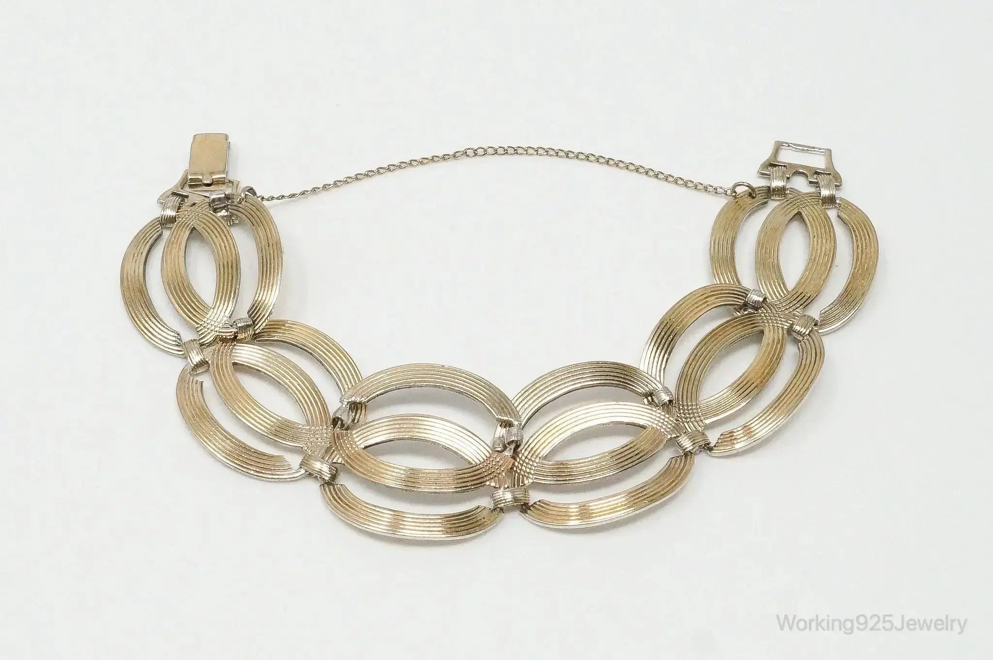 Vintage designer silver bracelet with 14K gold accents featuring Art Deco style, crafted by Plush Fashion Hub.