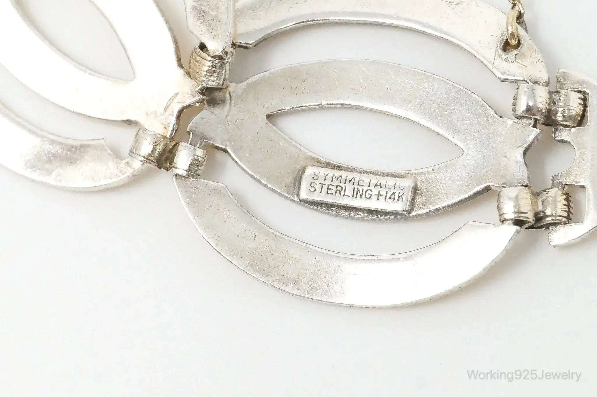 Vintage silver and 14K gold Art Deco bracelet with symmetrical design, crafted by Plush Fashion Hub.