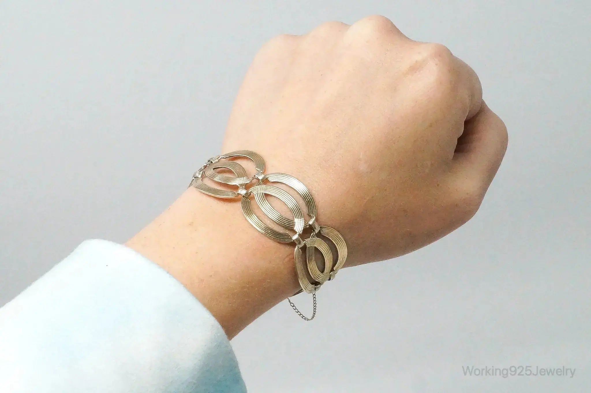 Vintage designer silver bracelet with 14K gold accents, featuring Art Deco style, sterling silver jewelry by Plush Fashion Hub.