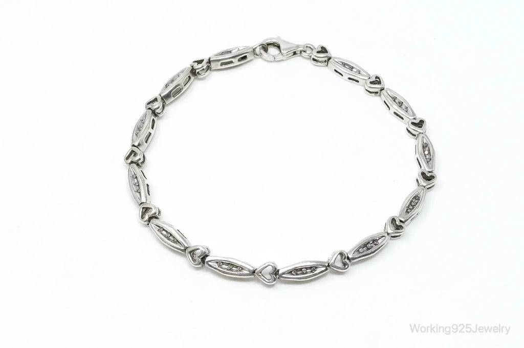 Vintage diamonds linked hearts sterling silver bracelet with intricate detail, crafted by Plush Fashion Hub.