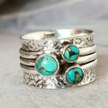Vintage three-eye turquoise hammered ring showcasing boho style and handcrafted metalwork, perfect for statement jewelry.