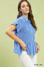 Washed linen blend smocked button-down shirt with ruffle sleeves, stylish casual top by Trendsi displayed on a model.
