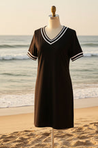 Women's contrast-color V-neck A-line dress by FitiqueFit featuring short sleeves and elegant, mid-rise fit, shown in a stylish design.