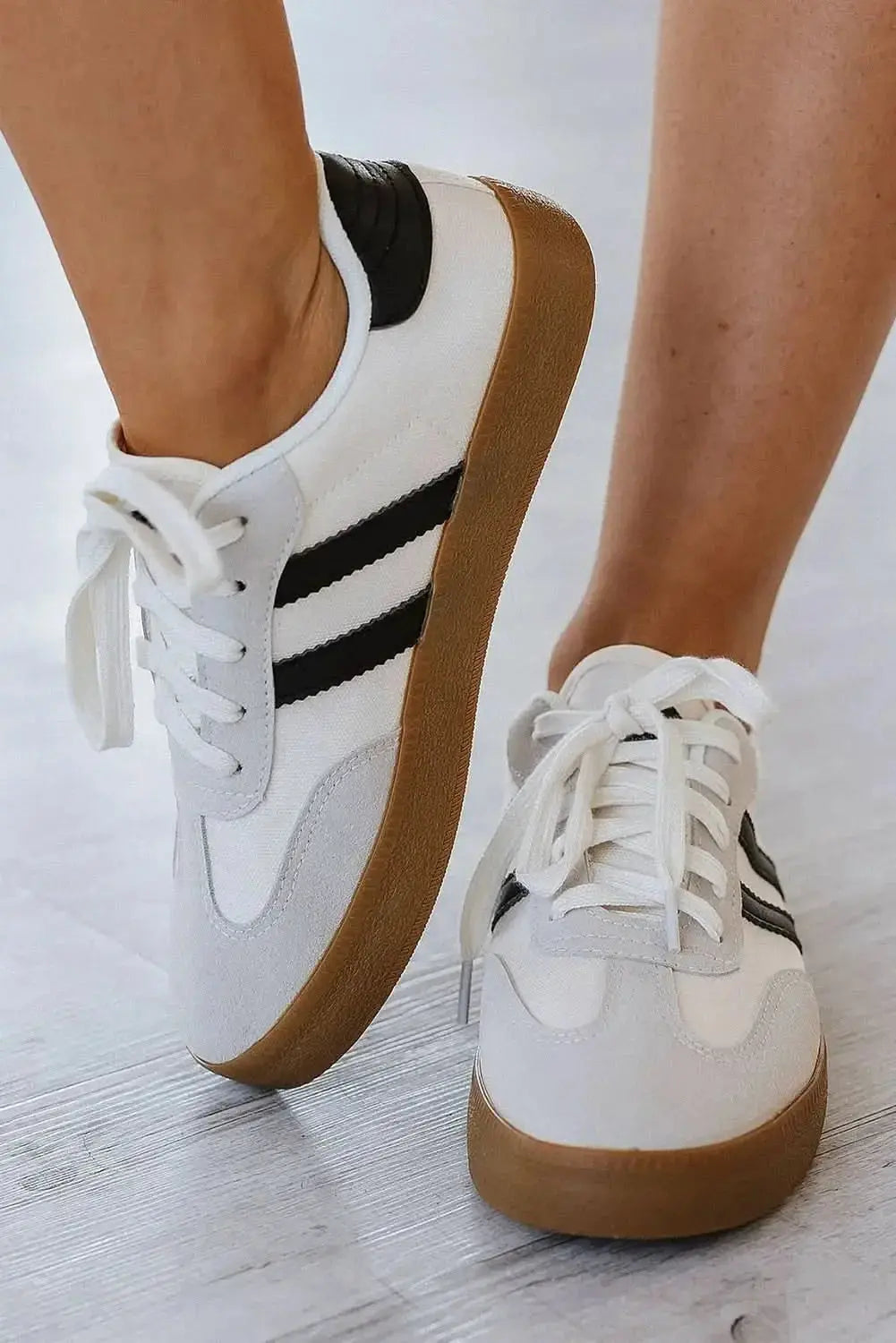 White striped women's lace-up sneakers by Gilded Glamour Shop, casual flat shoes for comfortable everyday walking.