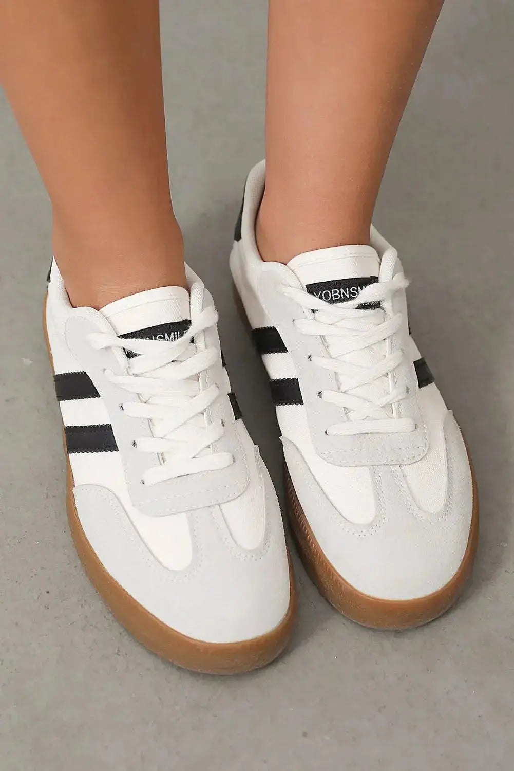 Women's white striped lace-up sneakers by Gilded Glamour Shop, casual flat shoes for comfortable everyday walking.