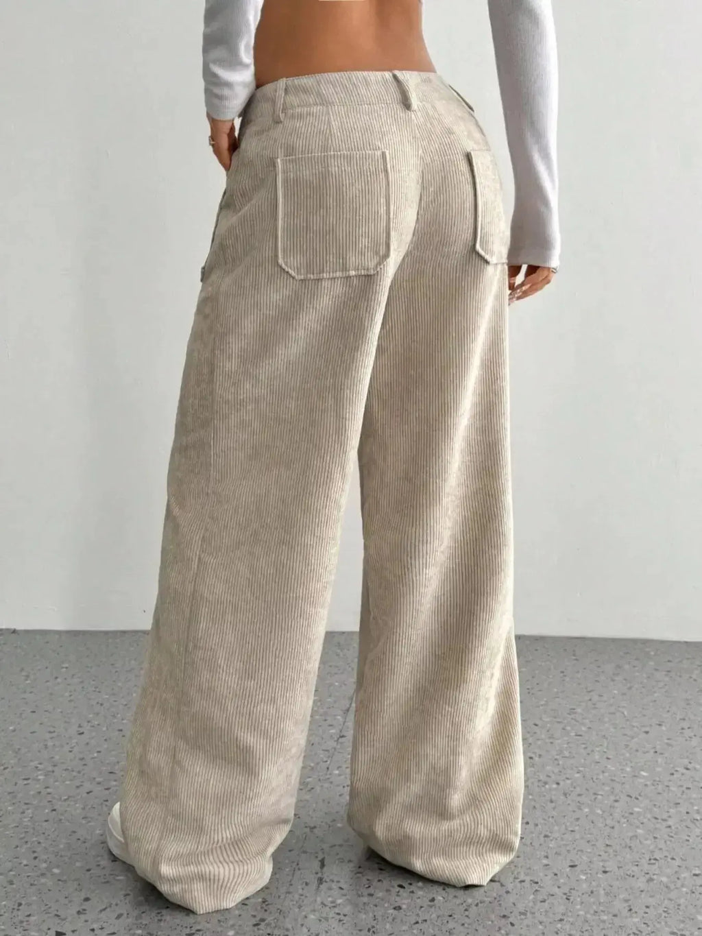 Women's high-waisted wide-leg corduroy trousers by Plush Fashion Hub, featuring a soft, textured fabric and relaxed fit.