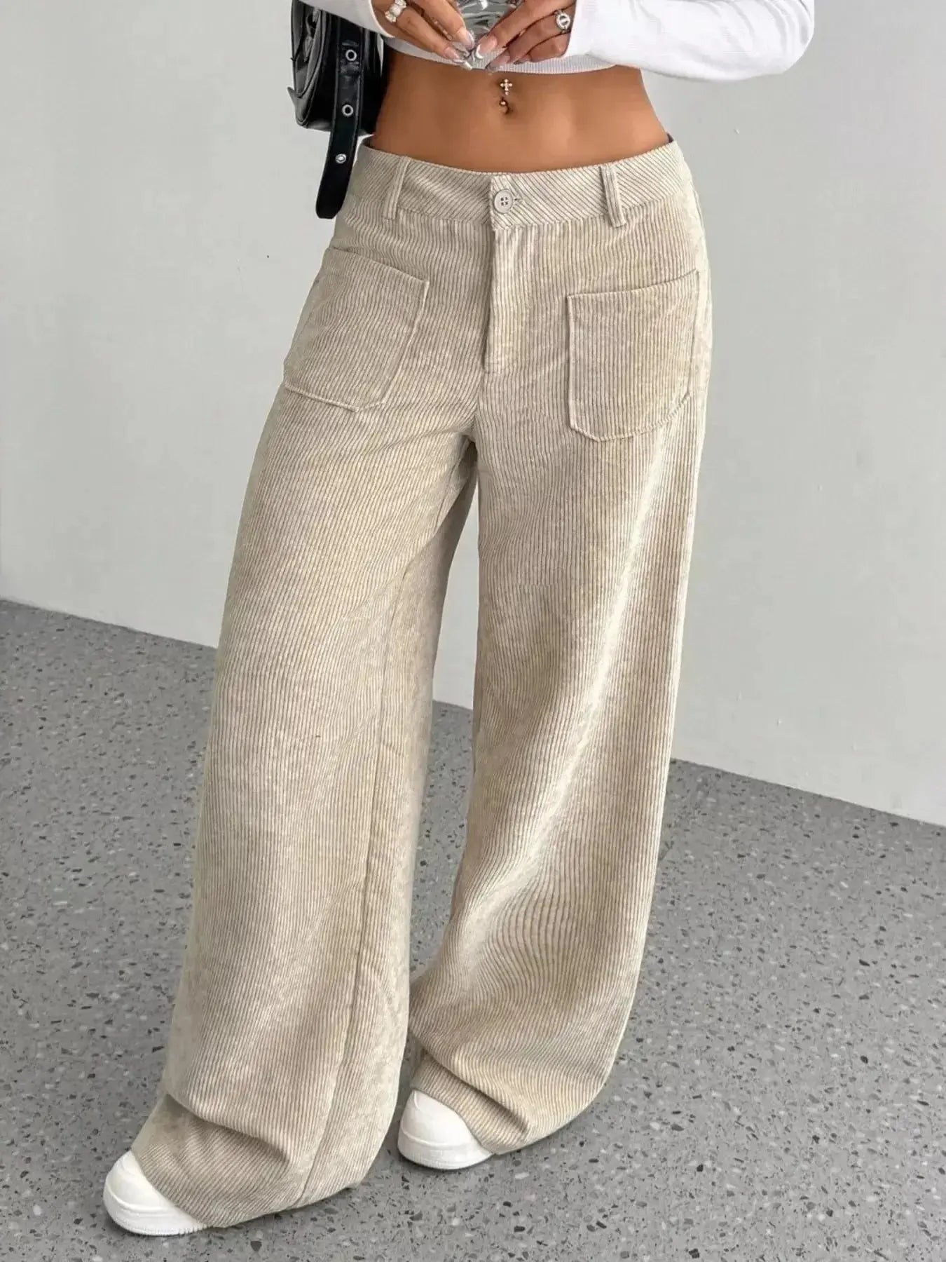 Women's high-waisted wide-leg corduroy pants by Plush Fashion Hub, shown in a soft, textured fabric with a relaxed fit.