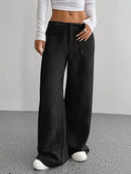 Women's high-waisted wide-leg corduroy pants by Plush Fashion Hub, shown in a stylish fit with a soft, textured fabric.
