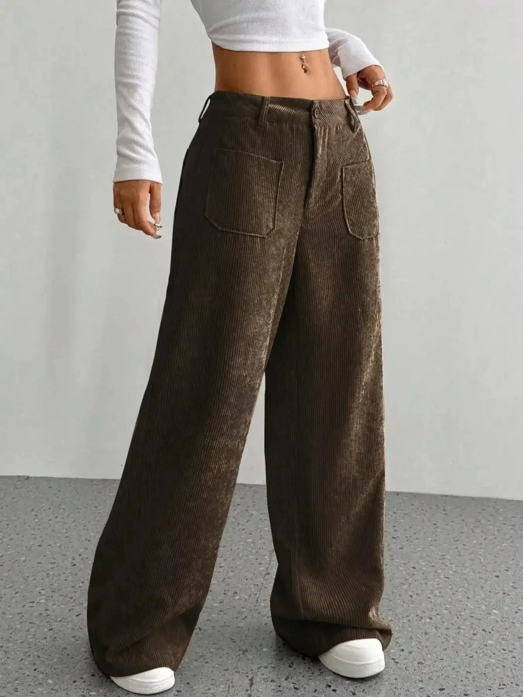 Women's high-waisted wide-leg corduroy pants by Plush Fashion Hub, featuring a textured fabric and relaxed fit.