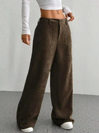 Women's high-waisted wide-leg corduroy pants by Plush Fashion Hub, featuring a textured fabric and relaxed fit.