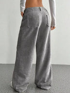 Women's high-waisted wide-leg corduroy pants by Plush Fashion Hub, shown in a stylish relaxed fit with textured fabric.
