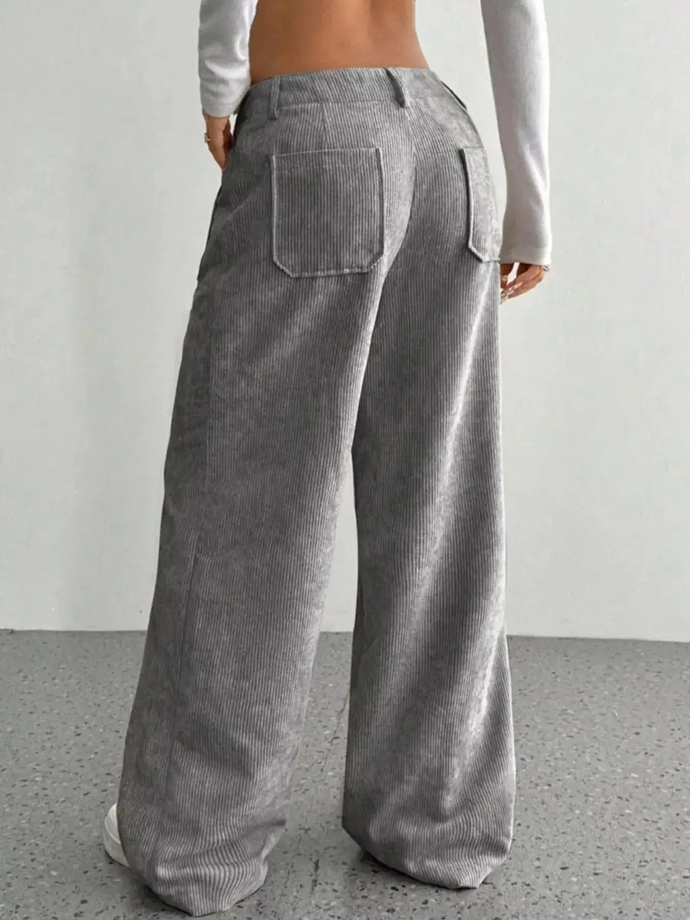 Women's high-waisted wide-leg corduroy pants by Plush Fashion Hub, shown in a stylish relaxed fit with textured fabric.