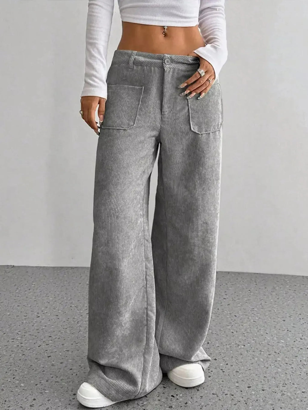 Women's high-waisted wide-leg corduroy pants in a plush fabric, shown in a neutral color, from Plush Fashion Hub.
