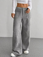 Women's high-waisted wide-leg corduroy pants in a plush fabric, shown in a neutral color, from Plush Fashion Hub.