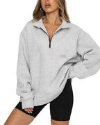 Women’s lightweight nylon hoodie with zip collar, loose fit, casual style by Plush Fashion Hub, shown on model with front view.