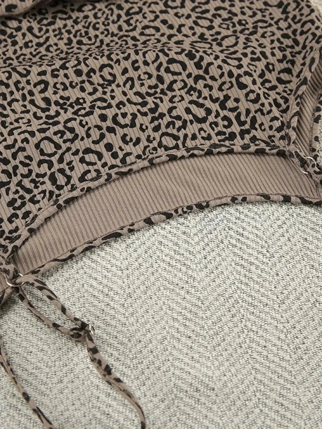 Women's leopard print pajama set with cami, shorts, and cardigan from Trendsi, featuring a stylish and comfortable lounge outfit.