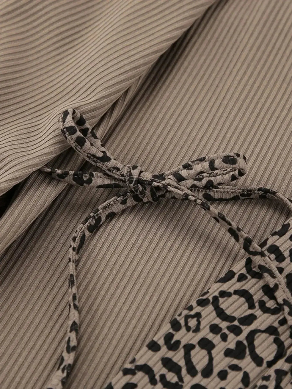 Women's leopard print pajama lounge set with cami, shorts, and cardigan by Trendsi, featuring a stylish and comfortable lounge ensemble.