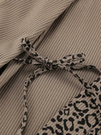 Women's leopard print pajama lounge set with cami, shorts, and cardigan by Trendsi, featuring a stylish and comfortable lounge ensemble.