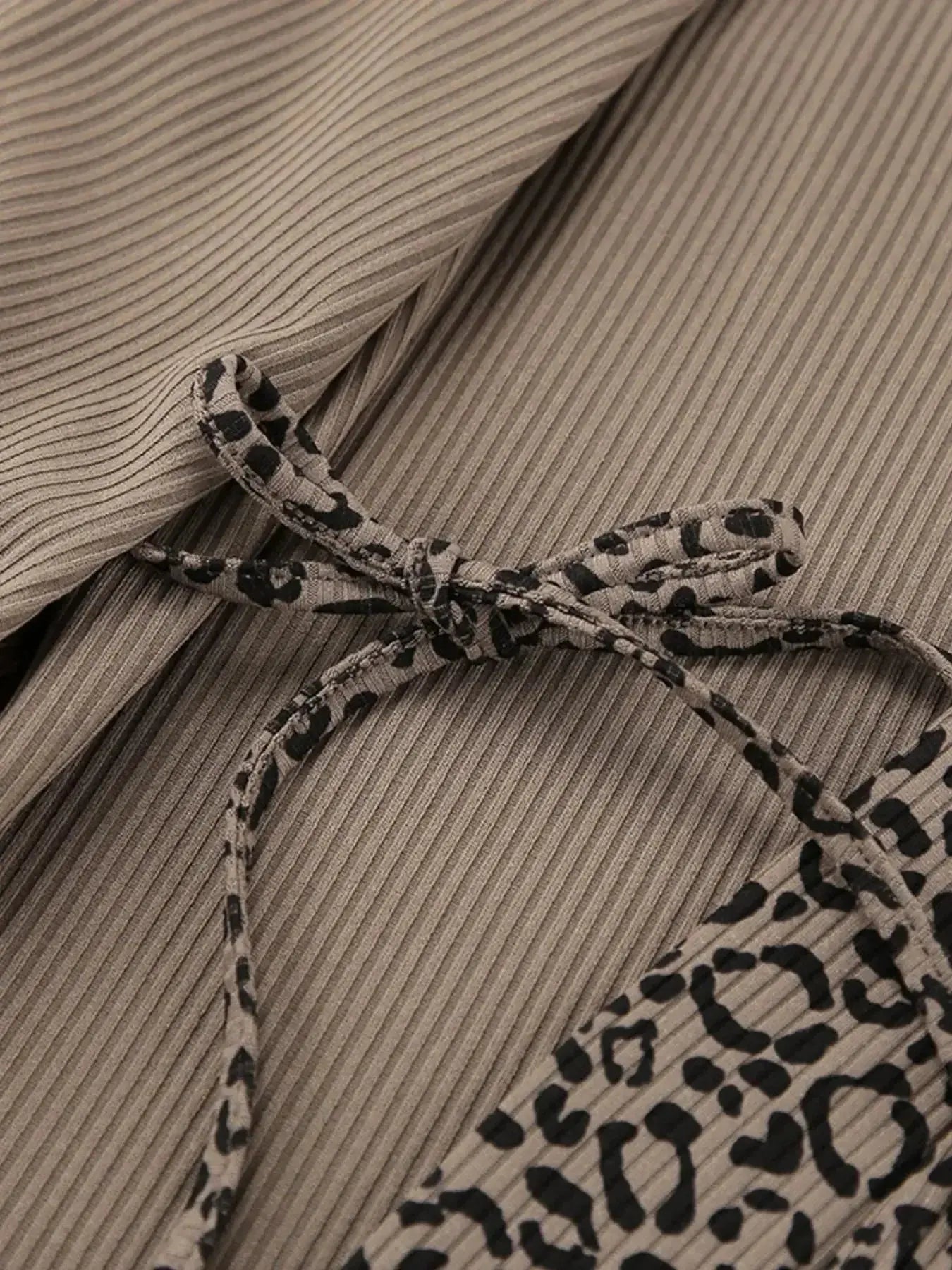 Women's leopard print pajama lounge set with cami, shorts, and cardigan by Trendsi, featuring a stylish and comfortable lounge ensemble.
