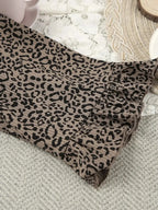 Women's leopard print pajama lounge set with cami, shorts, and cardigan by Trendsi, featuring a stylish and comfortable sleepwear ensemble.