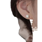 Elegant minimalist 925 sterling silver pearl stud earrings featuring geometric design, perfect for sophisticated women.