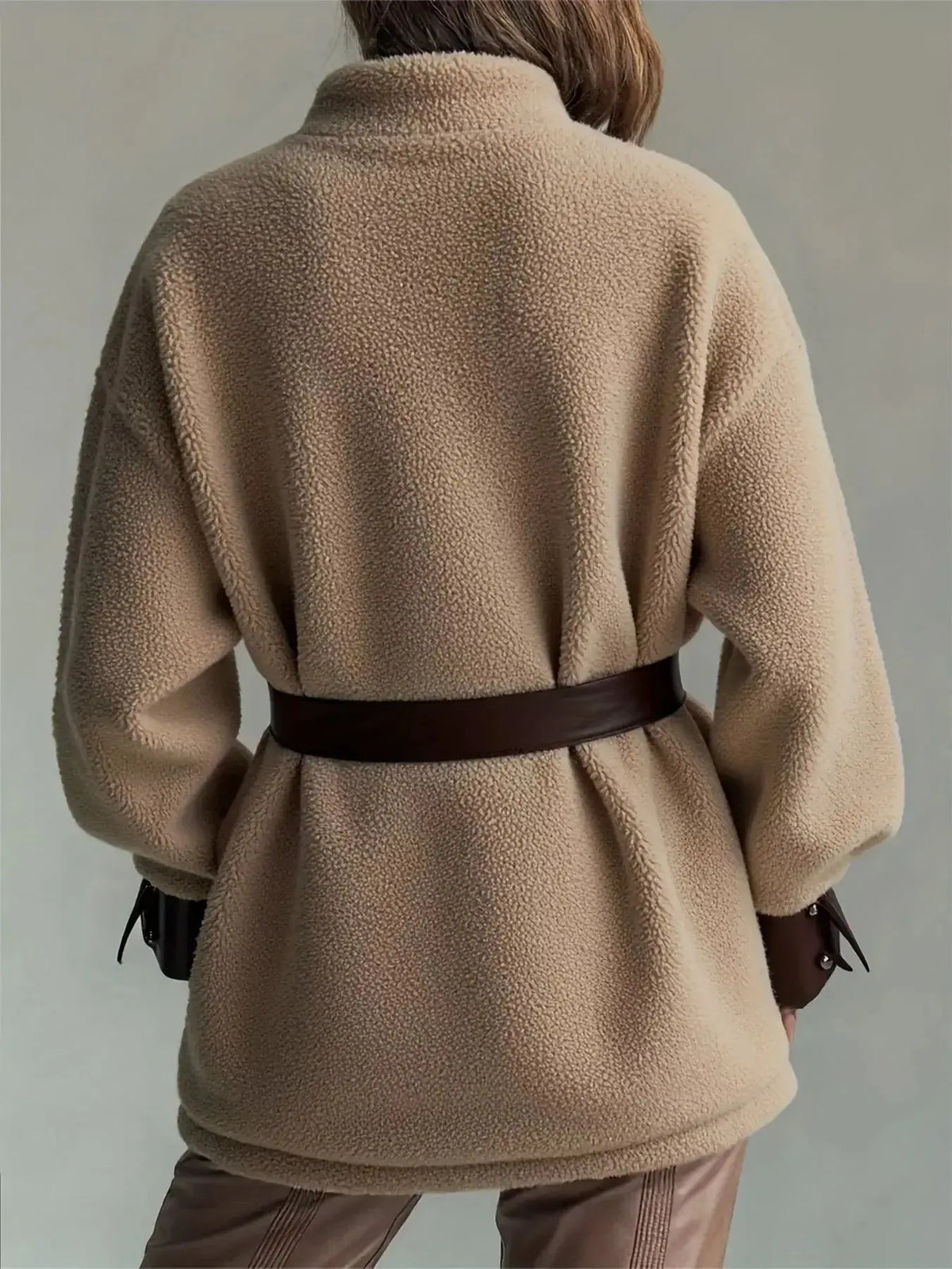 Women’s belted sherpa jacket with leather trim from Plush Fashion Hub, featuring a cozy fleece exterior and stylish leather accents.