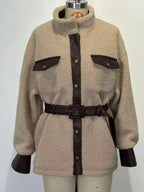 Women’s belted sherpa jacket with leather trim, featuring plush fabric and stylish design from Trendsi.